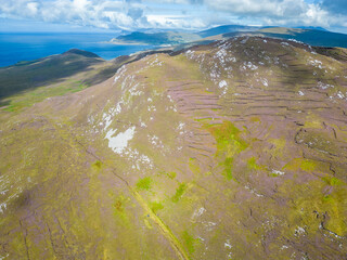 Aerial view of Granuaile Loop Walk Trail cover by peat holes in the bog, rocks, flowers and...