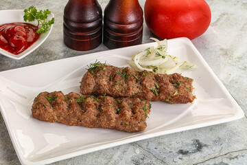 Kebab with beef served onion