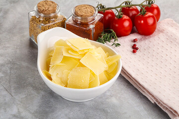 Sliced parmesan cheese in the bowl