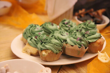 Green cupcakes on a white plate