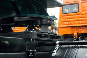 The truck is equipped with a fifth wheel with a special trailer attached to it