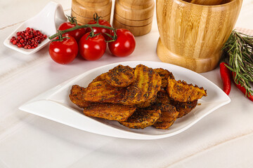 Golden baked potato Idaho with spices