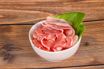 Sliced pork bacon in the bowl