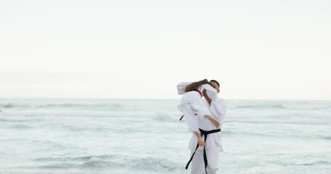 Beach, sports or child with father to play martial arts, fighting or fun games together for wellness or fitness. Swing, karate or happy master teaching a young girl or student after training at sea