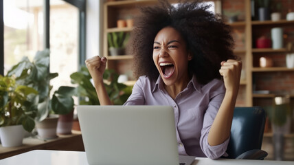 Ecstatic African American woman celebrates online job success.