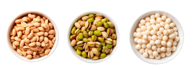 Fotobehang Top view of three bowls full of peanuts, pistachios and macadamia nuts on isolated transparent background © Pajaros Volando