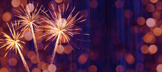 Sylvester 2024, New Year's Eve, New Year background banner - Firework Fireworks on rustic blue wooden wood texture.