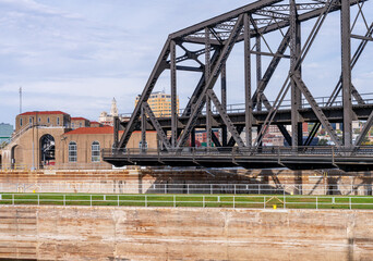 Historic swing span of the Arsenal or Government bridge swings open over the Lock and Dam No. 15 in Davenport, Iowa