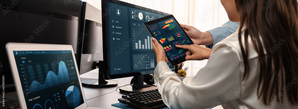 Poster analyst working on data analysis or bi dashboard on computer monitor. business team analyzing financ