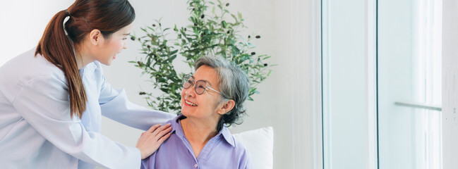 Medical staff taking and caregiver senior woman in Home. Healthcare and Home Care Concept. Female...