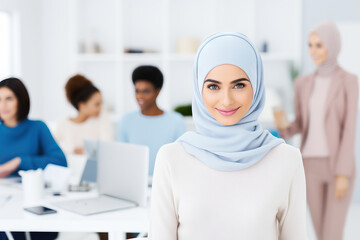 Diverse group of professional women with a focus on a smiling woman in a hijab