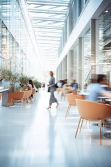 Vertical image of a business workplace with people in motion blur