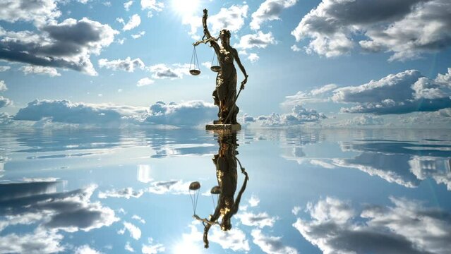 the statue of justice turns against the backdrop of clouds moving across the blue sky. time lapse 4k.