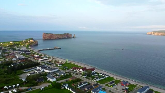 City of Perce, beach and rock of Perc&eacute;, postcard and symbol of the province of Quebec in Canada. Blue water beach on a sunny day. Prominent and very beautiful rock!