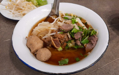 Thai Noodles with stewed beef and meatballs