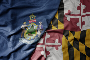 big waving colorful national flag of maryland state and flag of maine state .