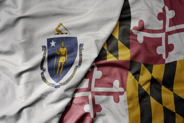big waving colorful national flag of maryland state and flag of massachusetts state .