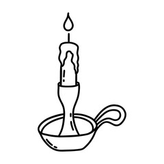 Burning candle in antique candlestick with handle. Black and white vector isolated illustration hand drawn doodle. Winter holiday season. Lighting element icon clip art
