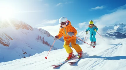 Poster  Child skiing in the mountains. Kid in ski school. Winter sport for kids. Family Christmas vacation in the Alps. Children learn downhill skiing. Alpine ski lesson for boy and girl. Outdoor snow fun. © Karol