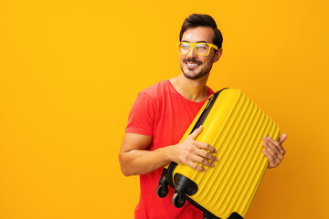 Man studio vacation suitcase traveler travel background yellow trip happy journey baggage flight