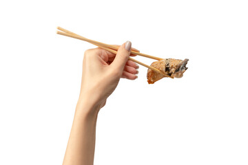 Naklejka premium Unagi sushi in a woman hand isolated.