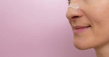 Mockup Closeup Nasal Strip on Female Nose on Pink Background. Stop Drug-Free Snoring Solution. Copy...