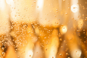 Close up macro shot of bubbles in a glass of champagne sparkling wine