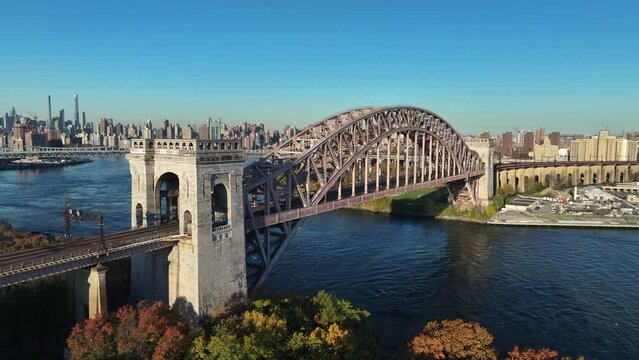 Aerial shot of New York City's Hell Gate Bridge on an autumn morning.