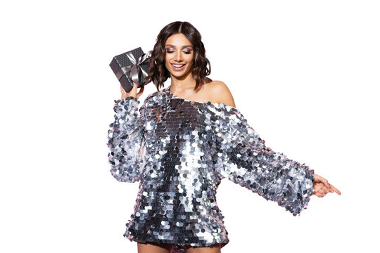 Beautiful happy woman wearing sparkle dress with gift box at celebration party. New Year eve celebrating concept. Isolated on transparent