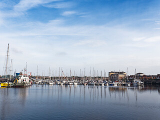 Fototapeta na wymiar Royal Quays marina at North Shields, UK with boat reflections