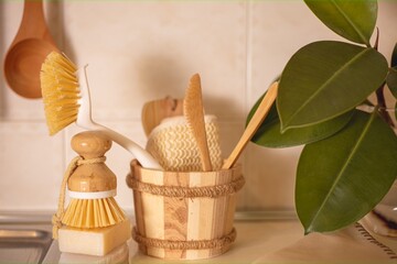  Eco-friendly accessories natural cleaning products , bamboo dish brushes. No plastic, green lifestyle.The concept of cleaning the kitchen zero waste. - obrazy, fototapety, plakaty