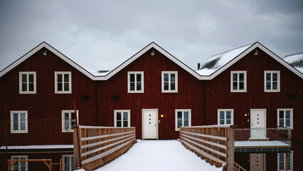 Obraz premium Traditional red norwegian houses covered with snow