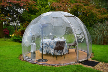Outdoor dome shaped dining pod, table for two