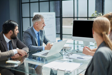 High angle view of business people having a brainstorming session.