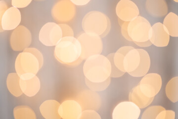 Abstract festive Christmas golden lights bokeh. Defocused, sparkling elements. Template for holiday...