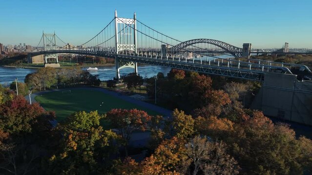 Aerial shot of Astoria Park on an autumn morning. Shot looking north over the track towards the Robert F. Kennedy Bridge and the Hell Gate Bridge.