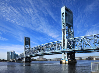 The Main Street Bridge in Jacksonville, Florida. The bridge uses trusses to lift up vertically, keeping it parallel while allowing ships to pass below on the St. Johns River. 