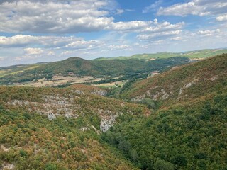 Fototapeta na wymiar Scenic shot of the mountains in Planina, Postojna on a sunny day