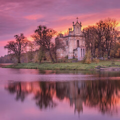 morning twilight above old church on the lake in Ukraine in square frame