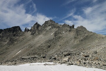 Big rocky mountain against the blue sky during the daytime