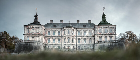 panoramic view to old abandoned palace under grey  sky