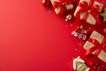 Deck the halls with festive flair. Overhead shot of earthy gift boxes, red and gold baubles,...