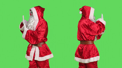 Father christmas pushing something aside, pretending to reject a big object in studio with...