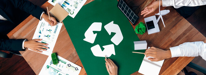 Top view business people planning and discussing on recycle reduce reuse policy symbol in office...