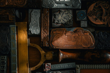 Vintage background printing press with frames and prints