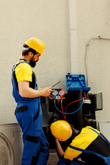 Competent mechanics fixing faulty blower fan causing frozen evaporator coil, resulting in poor...
