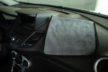 A Microfiber Inside a Car. Car Detailing and Cleaning Concept with Space for Copy