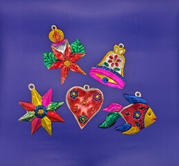 Mexican traditional tin christmas decorations on blue background