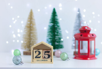 Christmas festive decor and calendar with 25 December on table. decorations, celebration, winter holiday