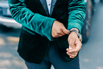 Afghani groom's wearing his watch hands close up